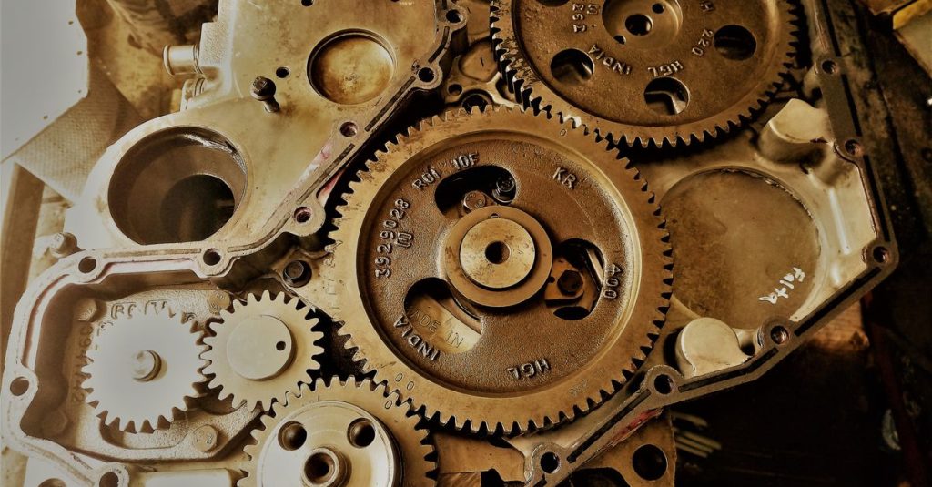 Detailed view of interconnected gears showcasing engineering precision and technology in a workshop.