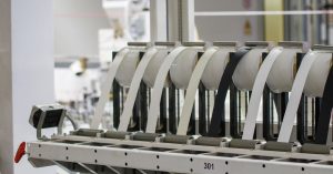 Modern industrial machine in operation in a manufacturing facility showcasing advanced technology.