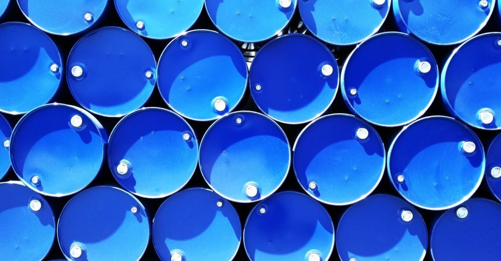 Top view of stacked blue industrial drums forming a geometric pattern.
