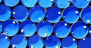 Top view of stacked blue industrial drums forming a geometric pattern.